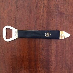 Gucci Black and Gold Logo Bottle Opener